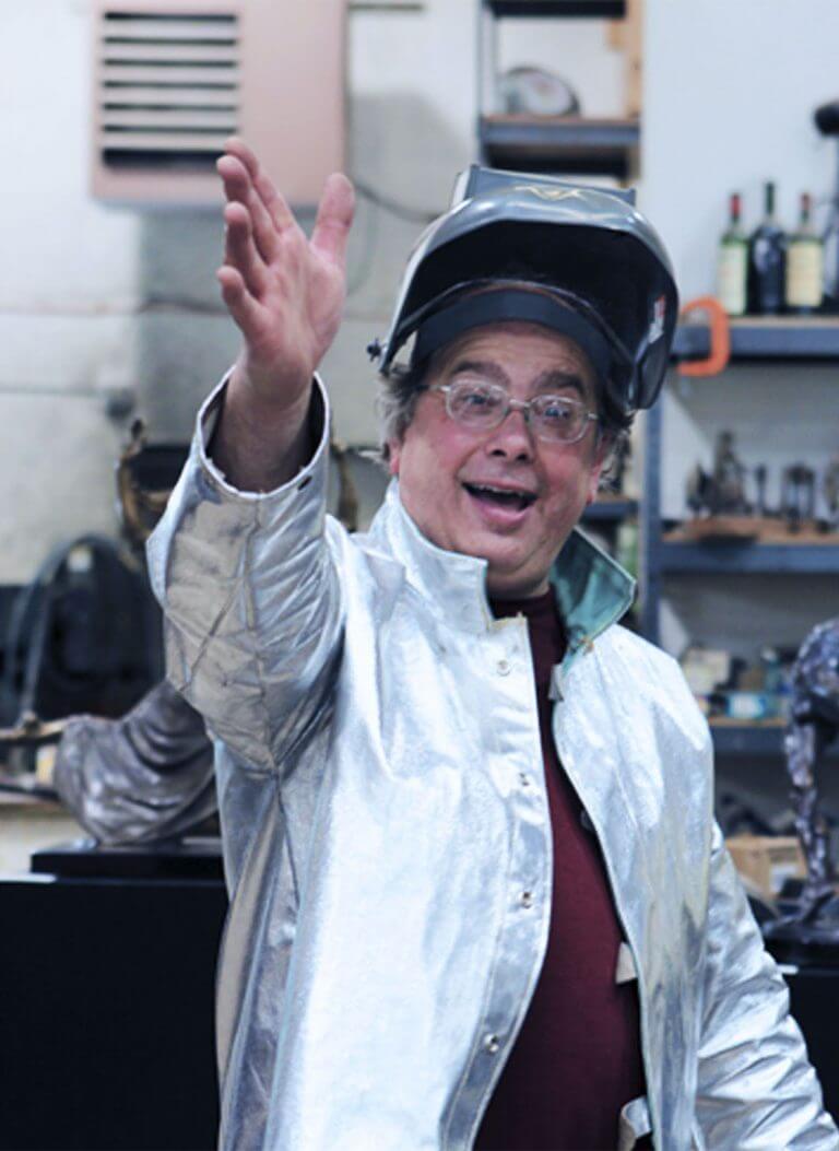 Come see us! Sculptor Andrew DeVries waving to welcome visitors
